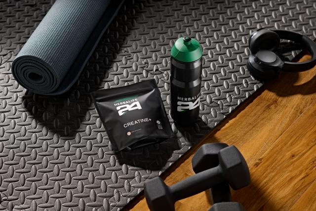 Herbalife H24 Creatine+ with shaker and fitness equipment