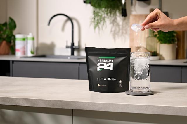 Preparing Herbalife H24 Creatine+ with water for daily use